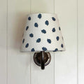 Finberry Blue Oak Leaf fabric shade wall light with blue oak leaf pattern on white linen and solid brass fittings.